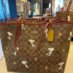 Coach X Peanuts City Tote In Signature Canvas With Snoopy Woodstock Print